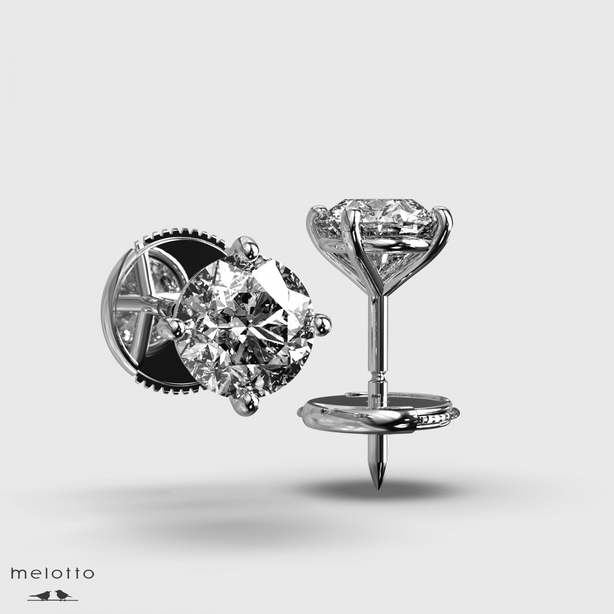Серьги-гвоздики с круглыми бриллиантами 0.74 карат
