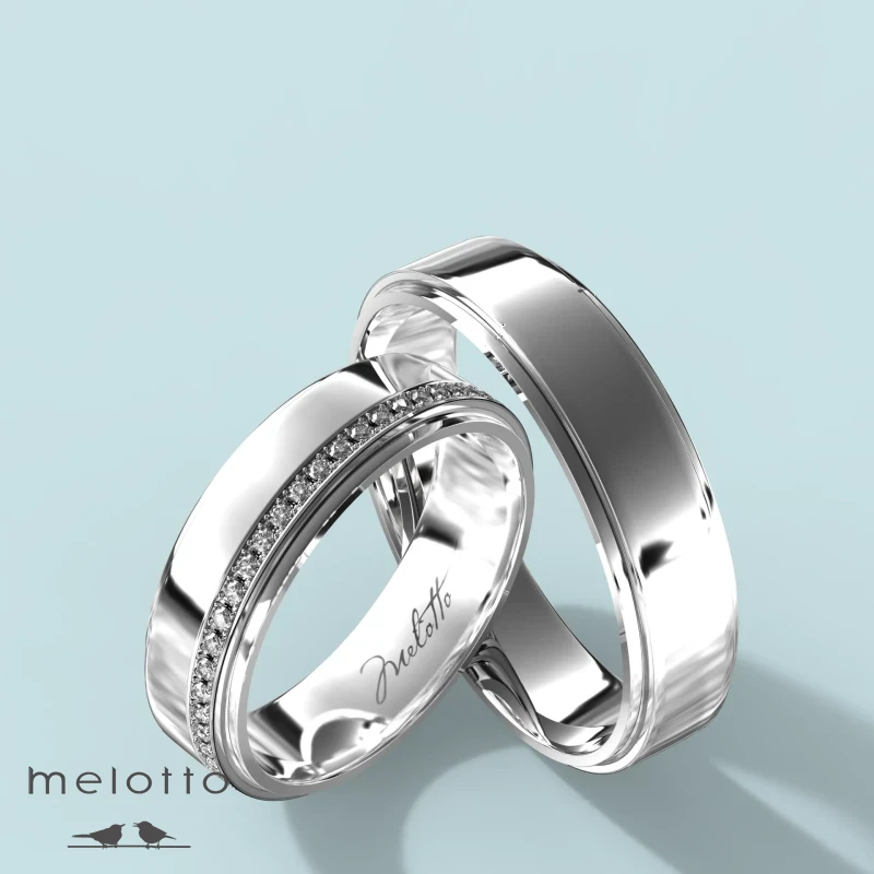 Геометрическая пара обручальных с бриллиантами