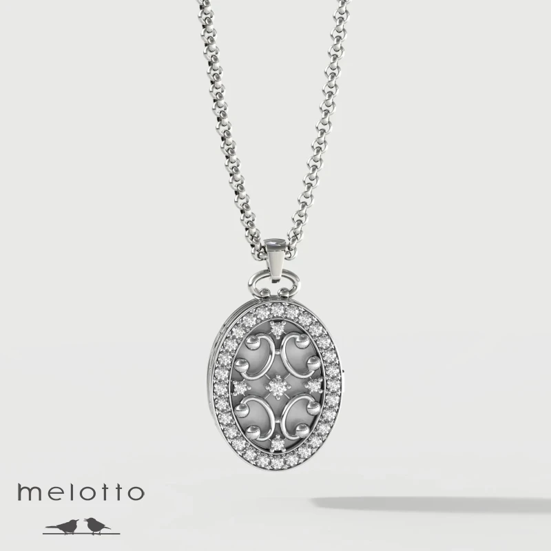 Медальон под два фото с бриллиантами Медальон под два фото с бриллиантами