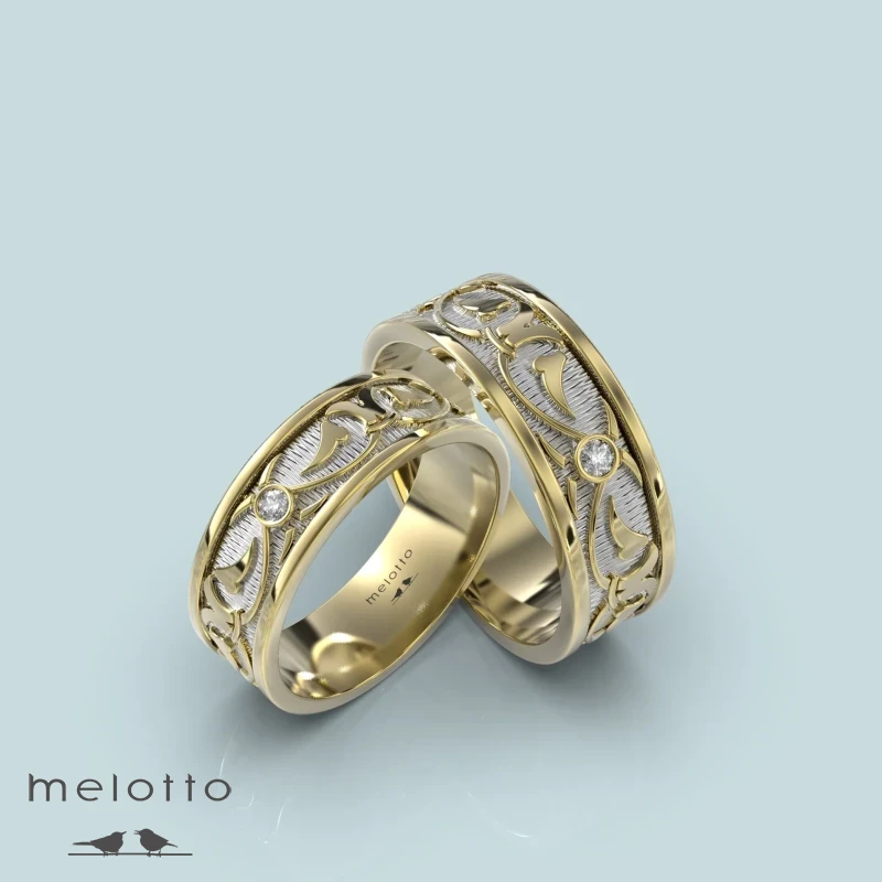 Обручальные кольца из желтого золота с одним бриллиантом Обручальные кольца из желтого золота с одним бриллиантом