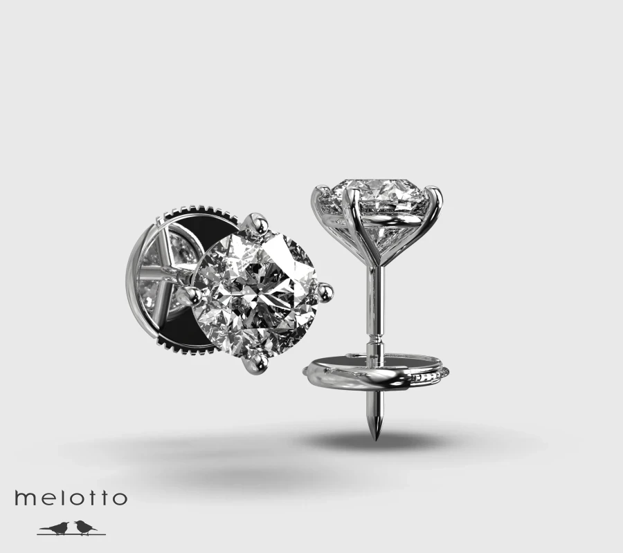 Серьги-гвоздики с круглыми бриллиантами 0.74 карат