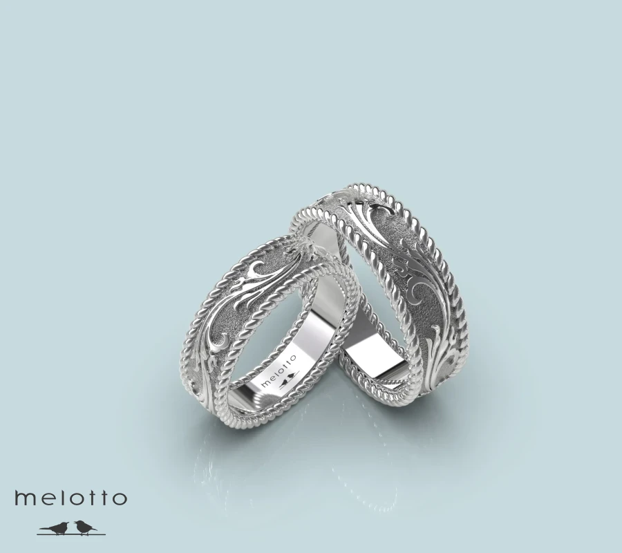 Золотые обручальные кольца с черненым узором