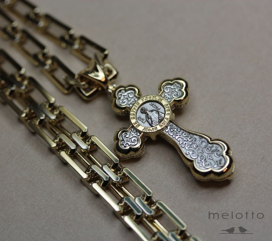 Золотой крест с ликом святого